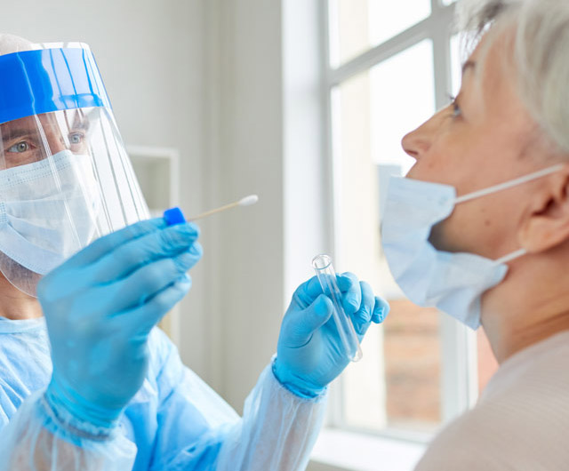 Doctor-in-PPE-Suit-Trying-to-take-Nasal-Swab-from-a-Person-to-test-for-Possible-Covid19-Infection