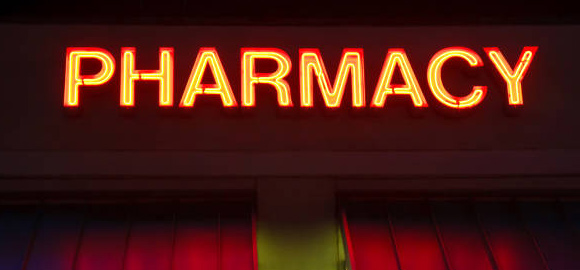 Late-Night-Pharmacy-Sign-Glowing-In-Night-Time