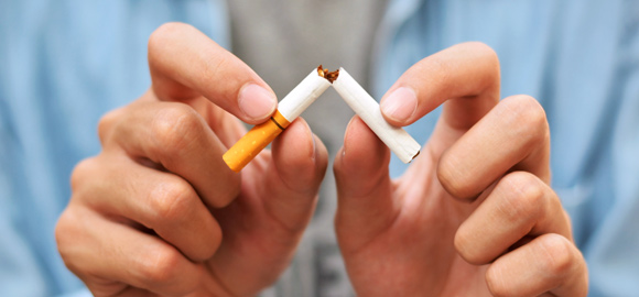 Man-Refusing-Smoking-by-holding-a-Broken-Cigarette