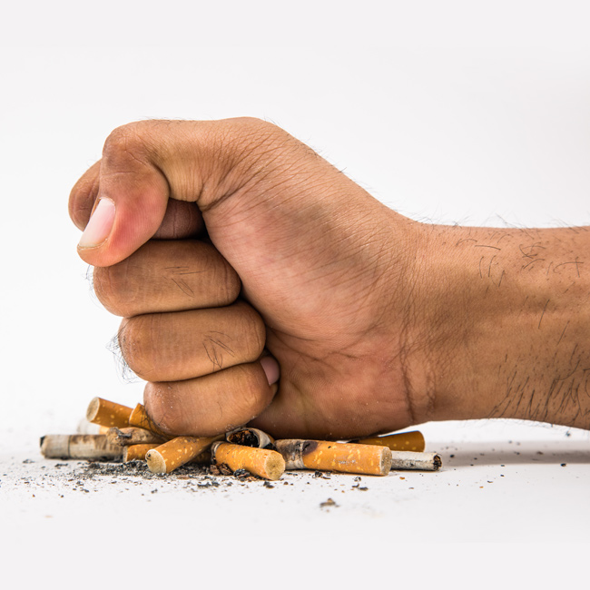 Male-Hand-Crushing-Cigarettes-to-Quit-Smoking-and-Tobacco-addiction
